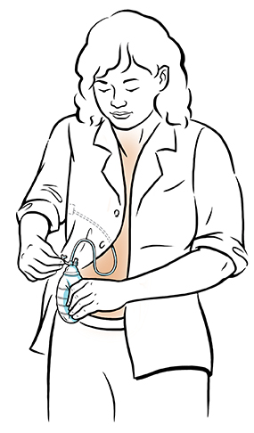 Woman squeezing drainage bulb and closing cap.